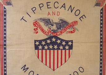 A design printed on cloth from the Benjamin Harrison home. The design is lined by stars and stripes, with two american flags protecting the corners. The center is an illustration of a bald eagle holding a piece of cloth in its mouth that reads 