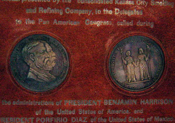 A brown box that has the appearance of being made from snakeskin; box opens up and medals swing out to prop the top up as a display case; two medals inside-one is intended for the President of the United States of America and the other is intended for the President of the United States of Mexico. Marked: 