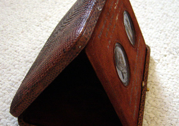 A brown box that has the appearance of being made from snakeskin; box opens up and medals swing out to prop the top up as a display case; two medals inside-one is intended for the President of the United States of America and the other is intended for the President of the United States of Mexico. Marked: 