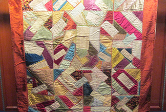 Crazy quilt with velvet boarder, mostly silk fabric in the pattern. Signatures include, Rutherford B. Hayes, Mrs. James K. Polk, John Wanamaker, Julia D. Grant, W. T. Sherman / general, Benj. Butterworth / Ohio, Agnes Author McElroy, Grover Cleveland, Frances Cleveland, T. DeWitt Talmage, and John J. Ingalls.