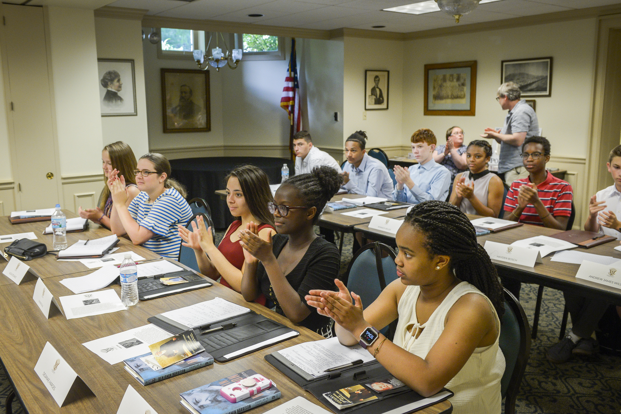 Photo of the future presidents of america classroom clapping after listening to a speaker in the classroom.
