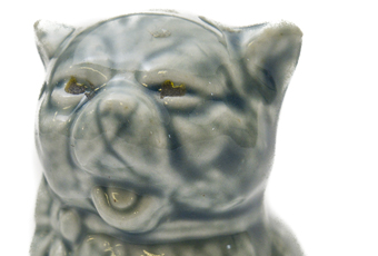 Cat figurine that says 