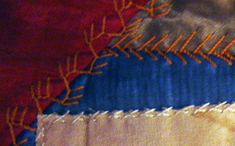 Crazy quilt with velvet boarder, mostly silk fabric in the pattern. Signatures include, Rutherford B. Hayes, Mrs. James K. Polk, John Wanamaker, Julia D. Grant, W. T. Sherman / general, Benj. Butterworth / Ohio, Agnes Author McElroy, Grover Cleveland, Frances Cleveland, T. DeWitt Talmage, and John J. Ingalls.