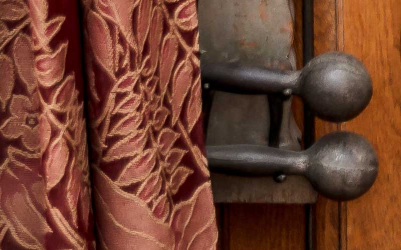 Oak case with iron dumbbell shaped weights (5) on ropes to be pulled, eight sets of wooden dumbbells and pair of Indian clubs. Metal plate: 