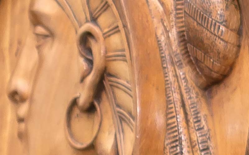 Original Harrison large rosewood and satinwood Renaissance Revival bed. Satinwood panel in tall head board. Large Egyptian medallion in center of head board that matches smaller medallions in chairs. The head board is 8 feet tall with squared feet. Squared urn design on foot board. Foot board has round massive legs. Ornamental pieces in medallions, scrolls, etched designs, etc.