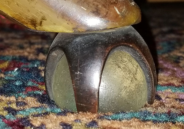 Several plaque on the back and arms of the chair convey the following: Top plaque: 