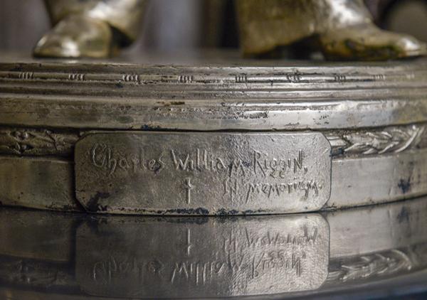 Full figure of a man in sailors uniform with hat. Figure has right hand on hip and left hand at side. Base has inscription 